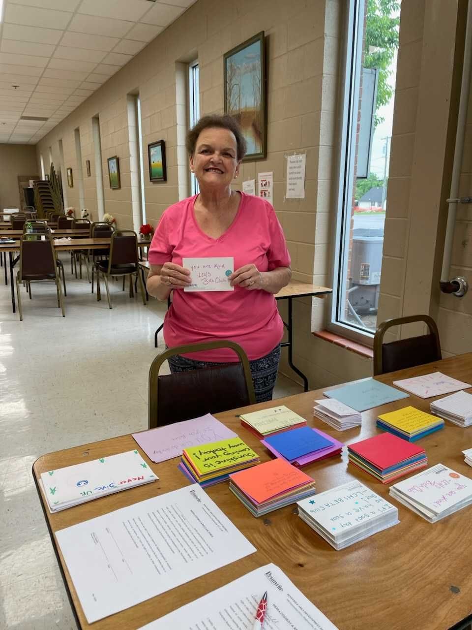 Denise Porter holds one of the cards that high school students send to older people in western Kentucky’s Pennyrile region as part of local suicide prevention efforts.